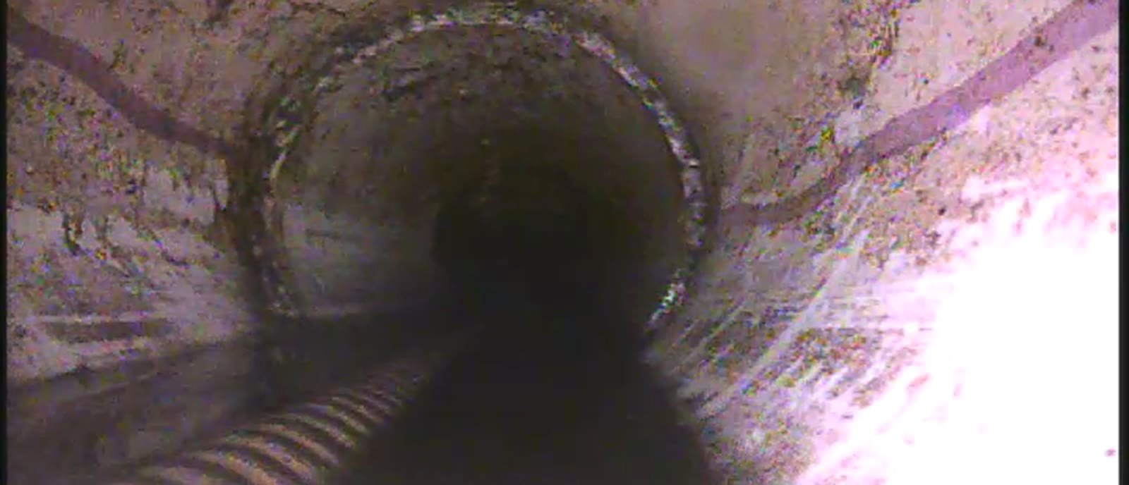 Maki Sewer and Drain cable descending a main sewer line during service in the Twin Cities metro